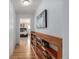 Hallway with shelving leading to a bedroom, adding functionality and style to the home's layout at 833 Applewood Dr, Lafayette, CO 80026