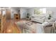 Comfortable living room featuring hardwood floors, couches and a colorful rug at 833 Applewood Dr, Lafayette, CO 80026