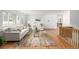 Bright living room featuring hardwood floors, couches and a colorful rug at 833 Applewood Dr, Lafayette, CO 80026