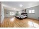 Spacious bedroom with ample natural light, light walls, and hardwood floors for comfort and style at 833 Applewood Dr, Lafayette, CO 80026