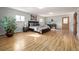 Large main bedroom with warm hardwood floors, many windows, and plenty of space at 833 Applewood Dr, Lafayette, CO 80026