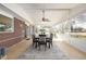 Sunroom with brick accent wall, ceiling fan, and access to the backyard at 833 Applewood Dr, Lafayette, CO 80026