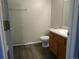 Bathroom with wood look flooring, wood vanity, and step in shower at 3271 E 103Rd Pl # 1308, Thornton, CO 80229