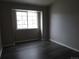 Light and airy bedroom showcasing a bright window and laminate flooring at 3271 E 103Rd Pl # 1308, Thornton, CO 80229