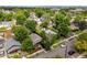 Aerial view showcases the property amidst mature trees at 4955 Julian St, Denver, CO 80221