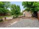 Spacious backyard featuring a shed and gravel at 4955 Julian St, Denver, CO 80221