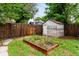 Backyard with garden bed, fence and shed at 4955 Julian St, Denver, CO 80221