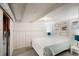 Comfortable bedroom features wainscoting, carpet, and serene natural light at 4955 Julian St, Denver, CO 80221