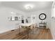 Dining room featuring hardwood floors, lots of light, and a modern table that seats six at 4955 Julian St, Denver, CO 80221