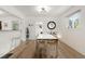 Dining room featuring hardwood floors, lots of light, and a modern table that seats six at 4955 Julian St, Denver, CO 80221