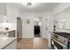 Modern kitchen with stainless appliances and ample storage with easy access to other rooms at 4955 Julian St, Denver, CO 80221