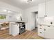 Open concept kitchen with stainless appliances, dining area, and bright natural light at 4955 Julian St, Denver, CO 80221