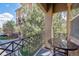 Relaxing balcony view with wrought iron railing and bistro table in a condominium setting at 7814 Inverness Blvd, Englewood, CO 80112