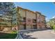 Exterior view of modern townhomes featuring garages and balconies at 7814 Inverness Blvd, Englewood, CO 80112