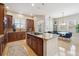 Beautiful kitchen with a center island, granite countertops, and stainless steel appliances at 7814 Inverness Blvd, Englewood, CO 80112