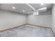 Finished basement room with neutral walls, trim and carpeting and recessed lighting at 7285 S Yukon Ct, Littleton, CO 80128