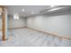 Spacious basement with gray carpet, neutral paint and recessed lighting at 7285 S Yukon Ct, Littleton, CO 80128
