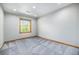 Neutral bedroom featuring a window for natural light at 7285 S Yukon Ct, Littleton, CO 80128