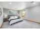 Bright bedroom with neutral walls, carpet and large window at 7285 S Yukon Ct, Littleton, CO 80128