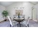 Cozy dining area featuring a round table, comfortable seating, and elegant decor for a warm ambiance at 7285 S Yukon Ct, Littleton, CO 80128
