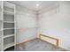 Walk-in closet with built-in shelving at 7285 S Yukon Ct, Littleton, CO 80128