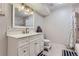 Bright bathroom with a white vanity, a shower over the tub and neutral décor at 7625 E Quincy Ave # 107, Denver, CO 80237