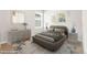 Comfortable bedroom offers a bed with decorative pillows, two side tables and stylish decor at 8836 Waco Ct, Commerce City, CO 80022