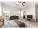 An airy bedroom with a view through two windows, ceiling fan and well-appointed decor at 8836 Waco Ct, Commerce City, CO 80022