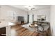 Bright, open living room with wood floors, a large window, and sliding glass doors at 8836 Waco Ct, Commerce City, CO 80022