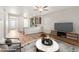 Bright, staged living room featuring an open floor plan and wood floors at 8836 Waco Ct, Commerce City, CO 80022