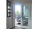 View of hot tub and outdoor scenery from inside the home, accessible through sliding glass doors at 83 Wilderness Cornerstone Rd, Evergreen, CO 80439