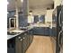 Spacious kitchen with a large center island, stainless steel appliances, and modern cabinetry at 83 Wilderness Cornerstone Rd, Evergreen, CO 80439