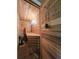 Indoor sauna with wooden benches and wall panels at 83 Wilderness Cornerstone Rd, Evergreen, CO 80439
