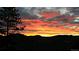 Beautiful horizon shot with a sunset over the mountains at 83 Wilderness Cornerstone Rd, Evergreen, CO 80439