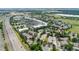 Aerial view displays the neighborhood location near a highway and commercial areas at 7120 S Clay St, Littleton, CO 80120
