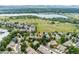 Aerial view showing proximity to lake and open space, residential area and walking paths at 7120 S Clay St, Littleton, CO 80120