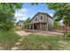 Spacious backyard features a covered patio and privacy fence at 7120 S Clay St, Littleton, CO 80120