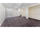 A large basement features neutral paint, recessed lighting and access to a bathroom at 7120 S Clay St, Littleton, CO 80120