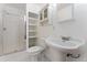 This well-lit bathroom is equipped with a shower, sleek vanity, and classic fixtures, offering a clean, functional space at 7120 S Clay St, Littleton, CO 80120