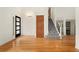 Spacious entryway featuring hardwood floors, stairs, and natural light at 7120 S Clay St, Littleton, CO 80120