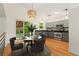 Well-lit kitchen with stainless steel appliances and an adjacent dining area at 7120 S Clay St, Littleton, CO 80120