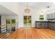Bright kitchen area with stainless steel appliances and sliding glass door to patio at 7120 S Clay St, Littleton, CO 80120