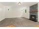 Spacious living room with natural light and a fireplace, ready for personalization at 7120 S Clay St, Littleton, CO 80120