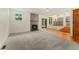 Cozy living room featuring a fireplace, sliding glass door, and hardwood floors at 7120 S Clay St, Littleton, CO 80120