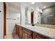 Modern bathroom with double sinks and granite countertop at 5320 Dual Rey Pt, Sedalia, CO 80135
