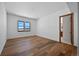 Bright bedroom with hardwood floors and mountain views at 5320 Dual Rey Pt, Sedalia, CO 80135