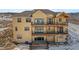 Back of house showing two-story deck and walkout basement at 5320 Dual Rey Pt, Sedalia, CO 80135