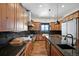 Modern kitchen with wood cabinets, granite counters, and stainless steel appliances at 5320 Dual Rey Pt, Sedalia, CO 80135