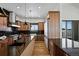 Modern kitchen with wood cabinets, granite counters, and stainless steel appliances at 5320 Dual Rey Pt, Sedalia, CO 80135