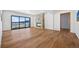 Living room with hardwood floors, stone fireplace, and sliding doors to a view at 5320 Dual Rey Pt, Sedalia, CO 80135
